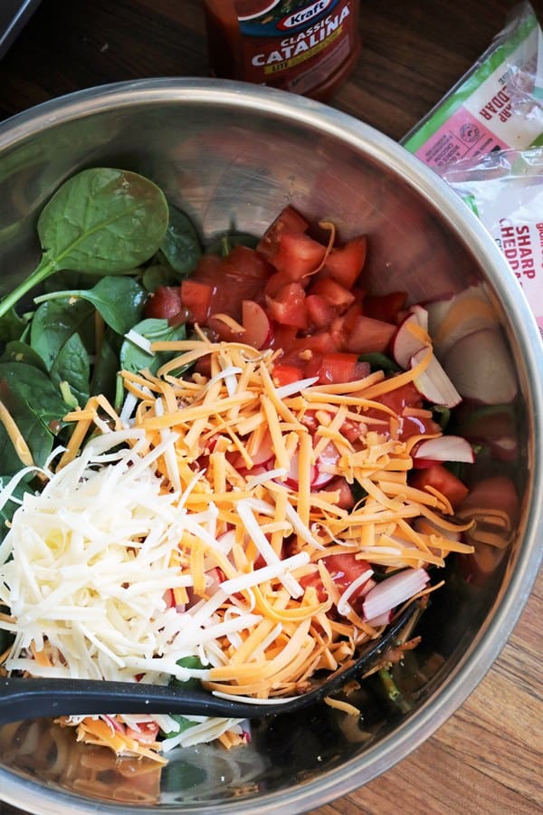 Making Mom’s Frito Taco Salad with Catalina Dressing.