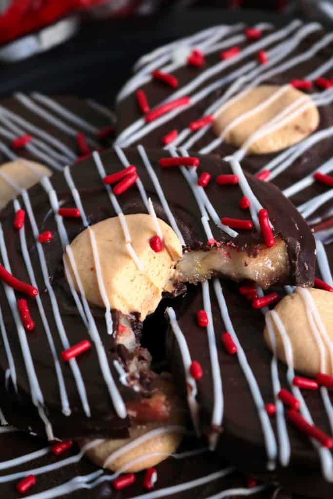 Bite out of a Buckeye Chocolate Peanut Butter Apple Slice.