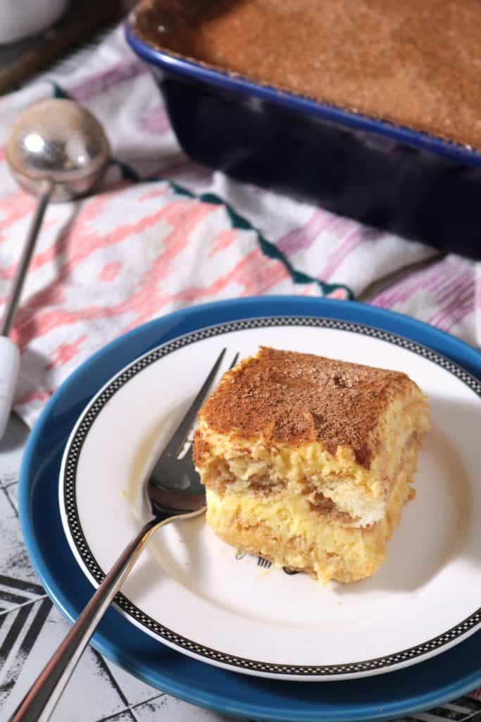 Slice of Chai Tiramisu on a plate.