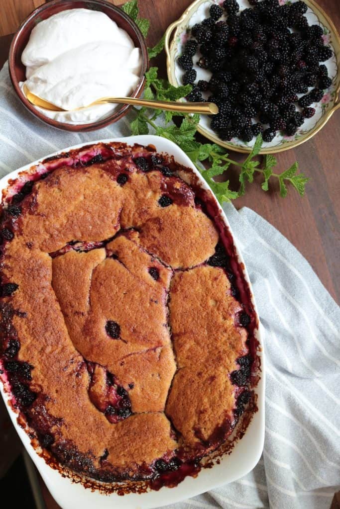 Grandma's Old-Fashioned Blackberry Cobbler with Whipped Cream.