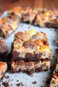 Stack of Chocolate Peanut Butter 7-Layer Bars.