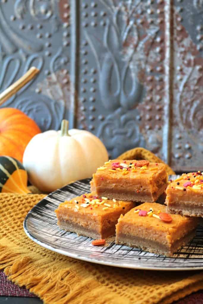 Stack of Pumpkin Gooey Butter Cake Bars.