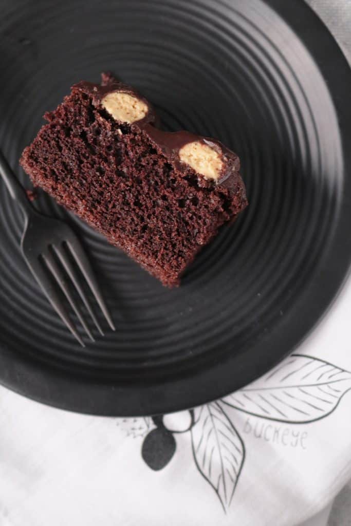 Slice of Peanut Butter Chocolate Bumpy Cake on a plate.
