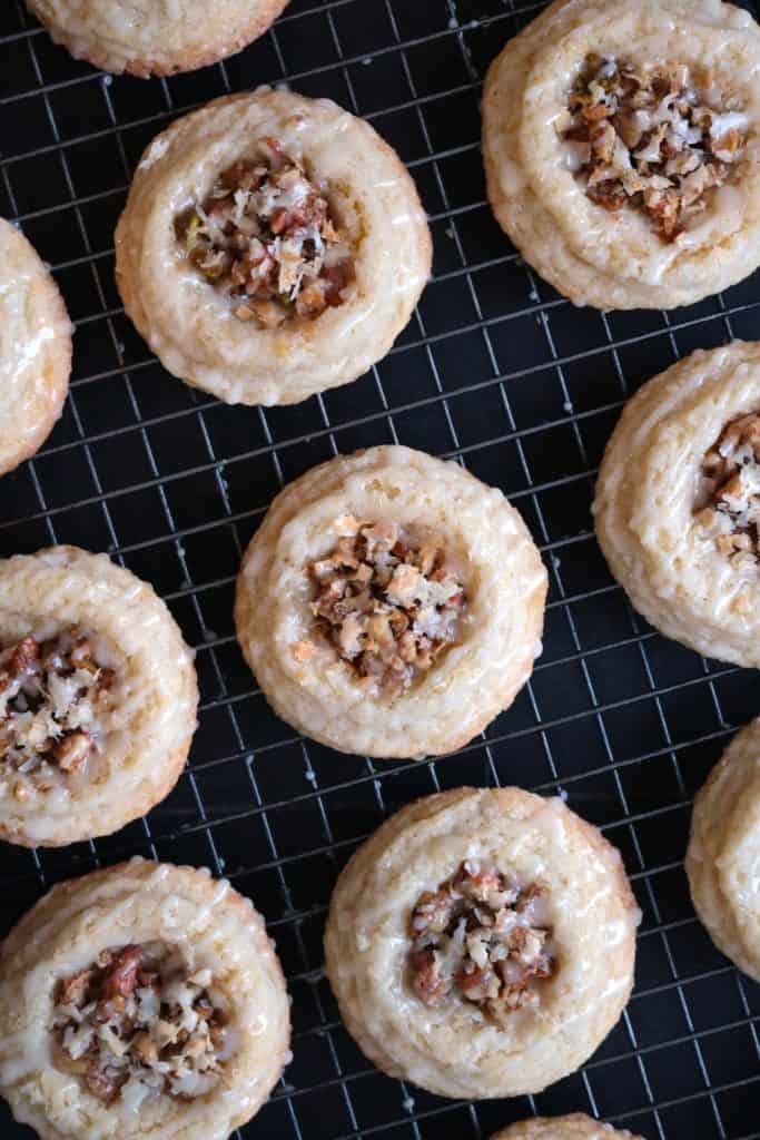 Baklava Thumbprint Cookies on a white rack.