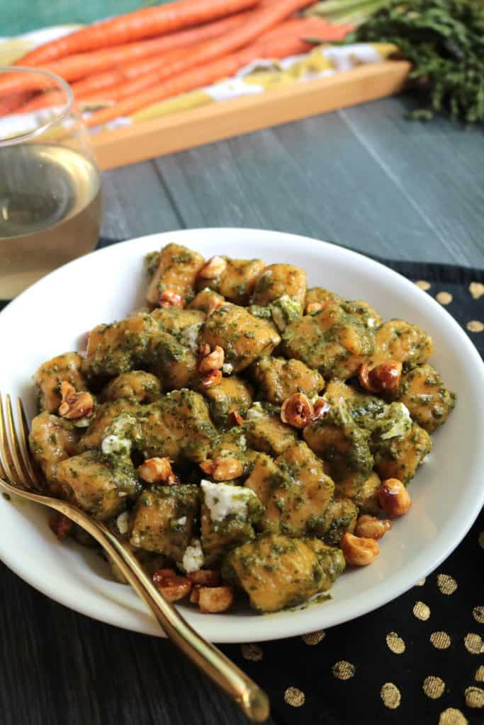 Carrot Gnocchi with Candied Hazelnuts and Carrot Top Pesto.