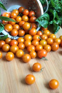 Cherry tomatoes and fresh basil.