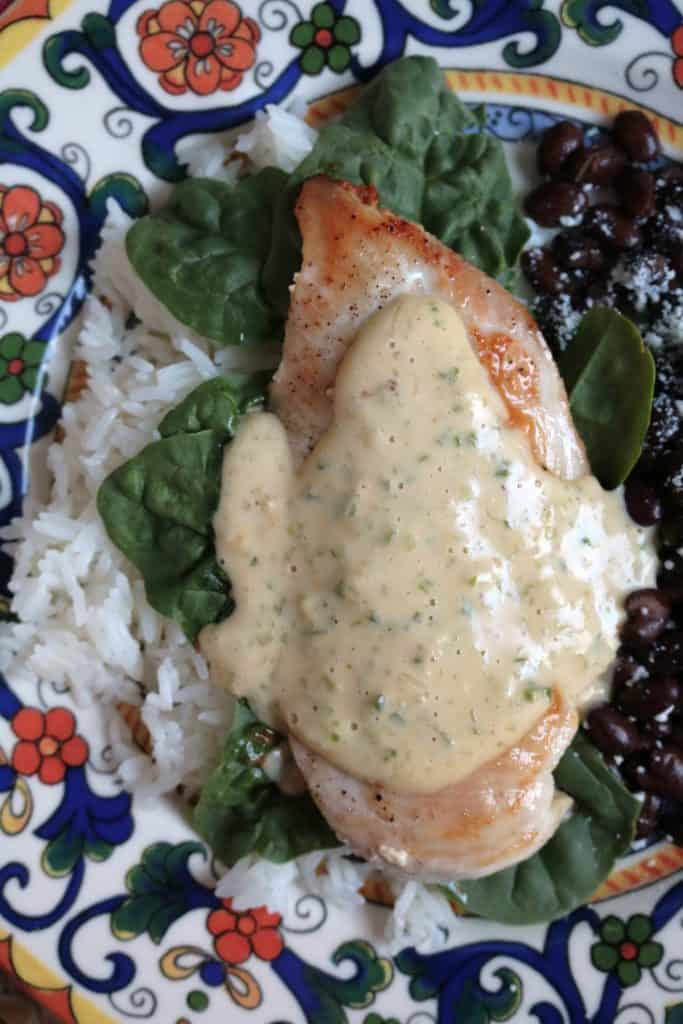 Caramelized Chicken with Jalapeno Cream, Black Beans, Spinach, and Rice.