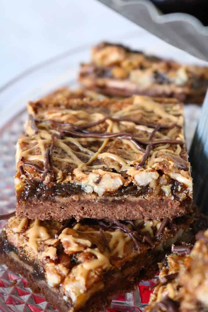 Stack of Peanut Butter Chocolate Pecan Pie Bars.