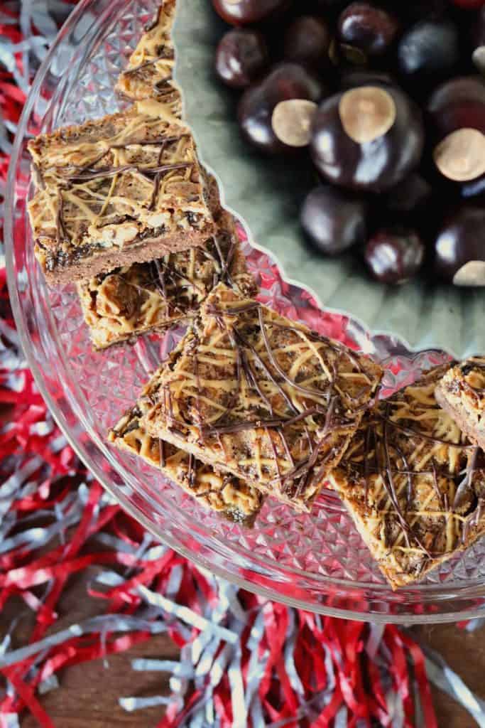 Peanut Butter Chocolate Pecan Pie Bars on Platter.