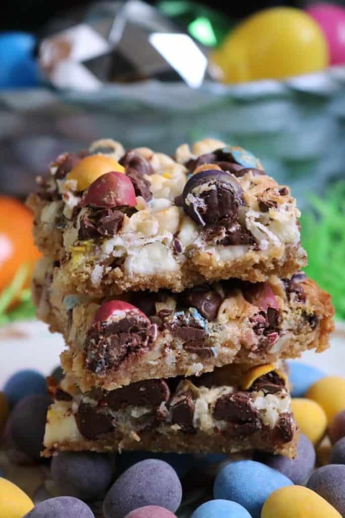 Stack of Cadbury Mini Eggs Easter 7 Layer Bars.