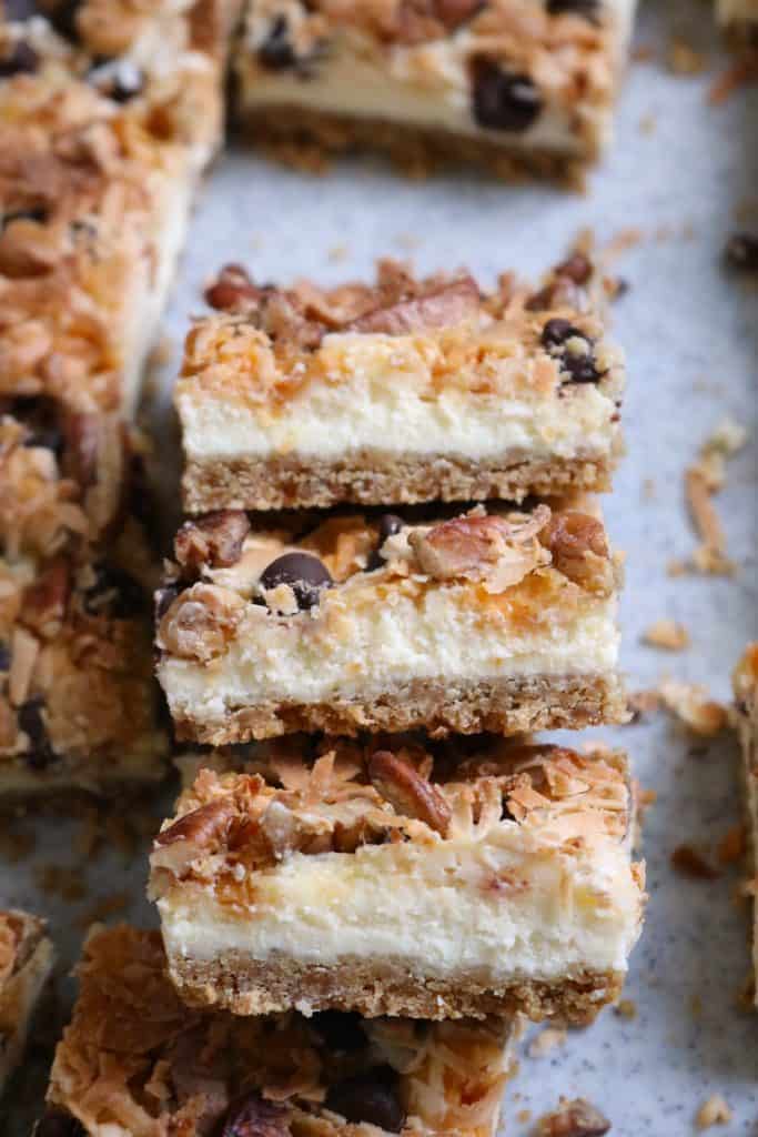 Stack of Seven Layer Cheesecake Bars.