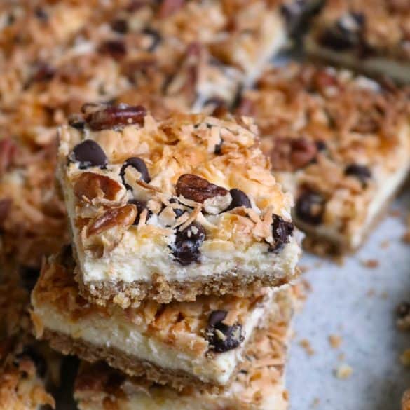 Seven Layer Cheesecake Bars Stacked.