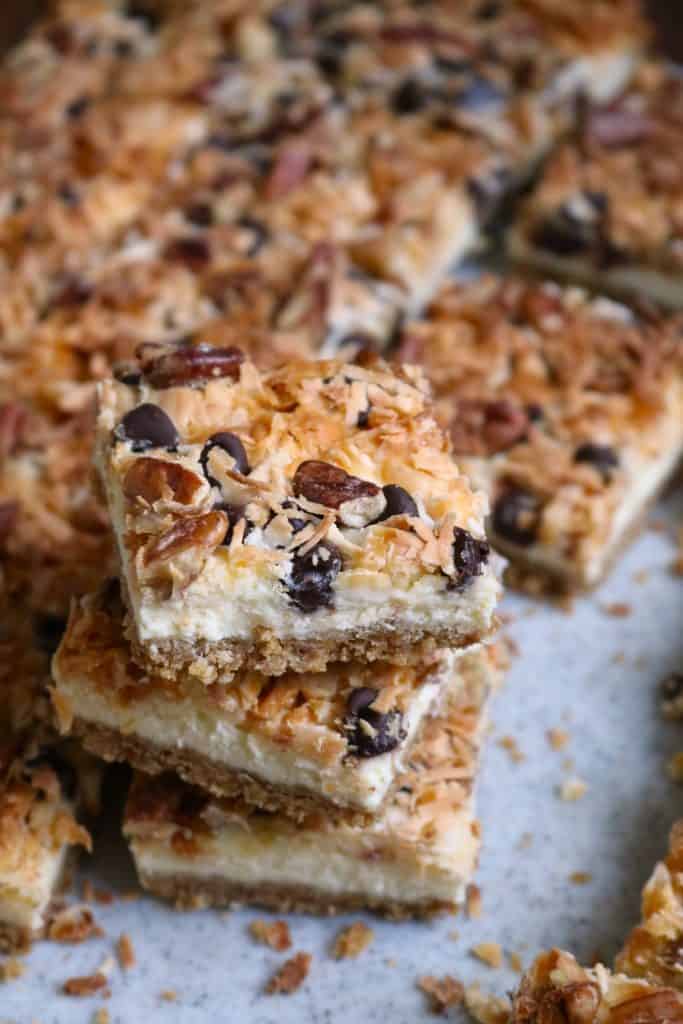 Seven Layer Cheesecake Bars Stacked.