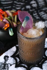 Poison Apple Cider with Gummy Worm.