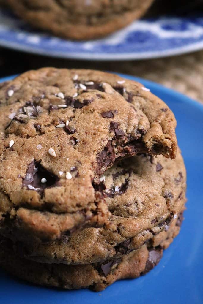 Bite out of  a Tahini Dark Chocolate Chip Cookie.