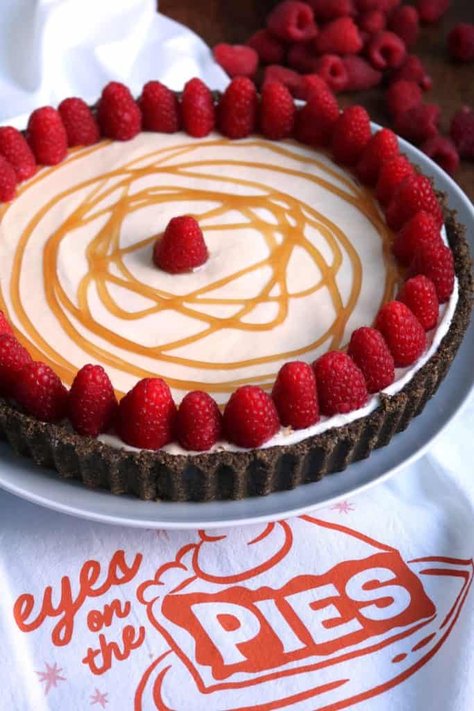 No-Bake White Chocolate Pie topped with Raspberries.