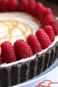 Raspberries on top of White Chocolate Pie.