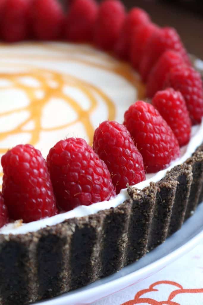 Raspberries on top of White Chocolate Pie.