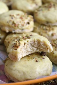 Bite out of Pistachio Lemon Ricotta Cookies.