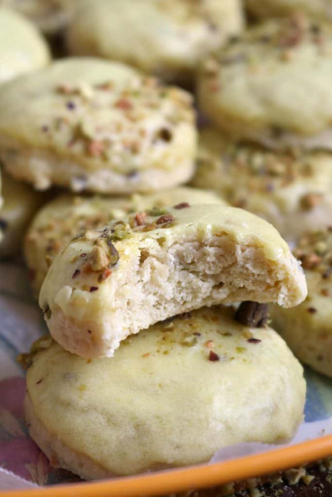 Bite out of Pistachio Lemon Ricotta Cookies.