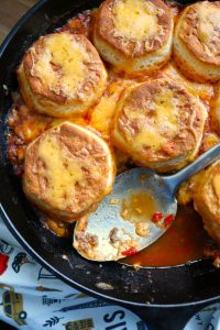 Sloppy Joe Pot Pie with Biscuits made in a Cast Iron Skillet.