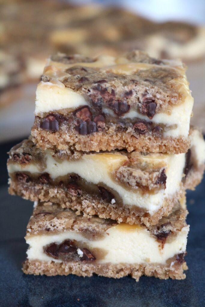 Stack of Chocolate Chip Cookie Dough Cheesecake Bars.