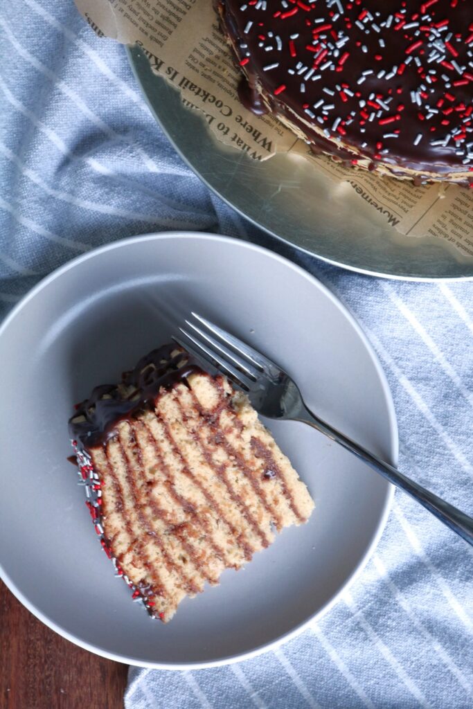 Slice of Peanut Butter Smith Island Cake on a Plate.